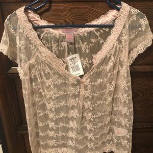 See-through cream colored blouse